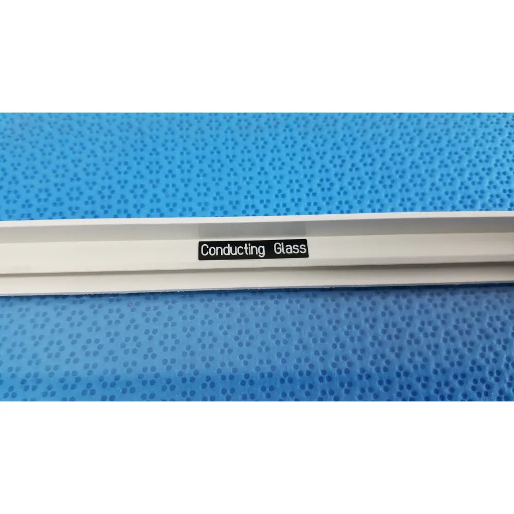 White mettler toledo XP205 conducting glass draft shield strip with black conducting glass label affixed to its surface