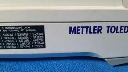 White mettler toledo analytical balance with blue lettering and black patent label for xp5003sdr communications module
