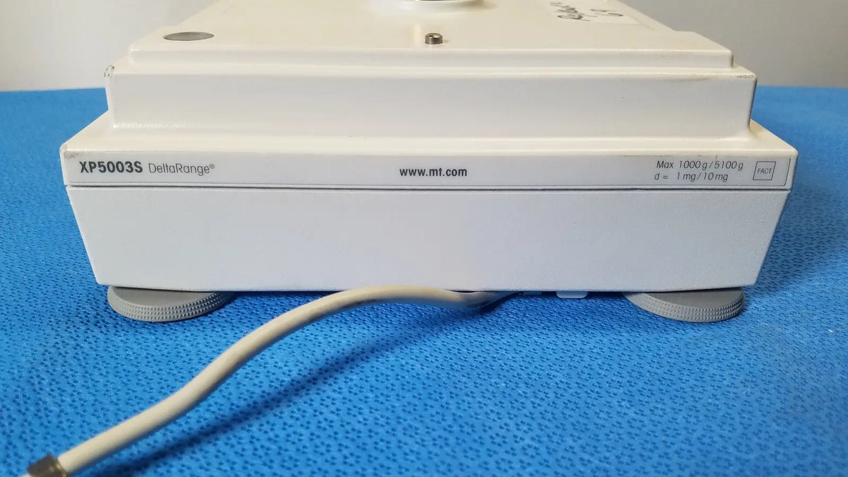 White rectangular laboratory balance mettler toledo xp5003sdr with specifications on side for toledo xp5003sdr communications module