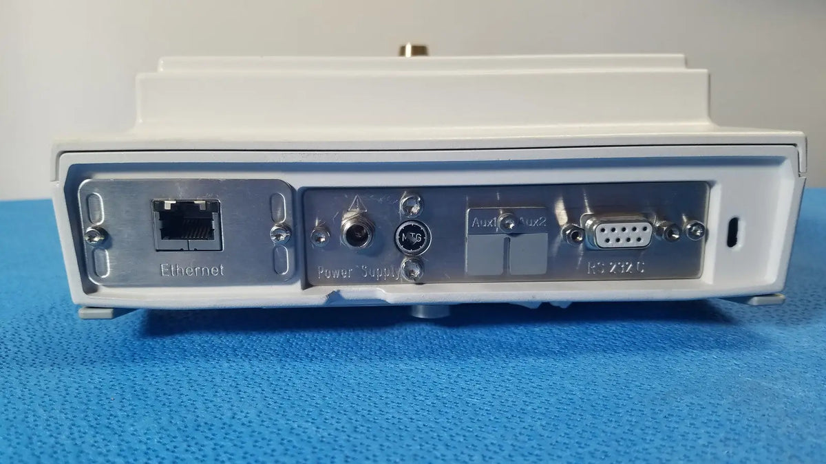Back side of white rectangular mettler toledo xp5003sdr communications module with silver metal panel and ethernet port