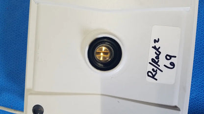 White plastic wall-mounted electrical outlet with brass screw and black rubber grommet for mettler toledo xp5003sdr communications module
