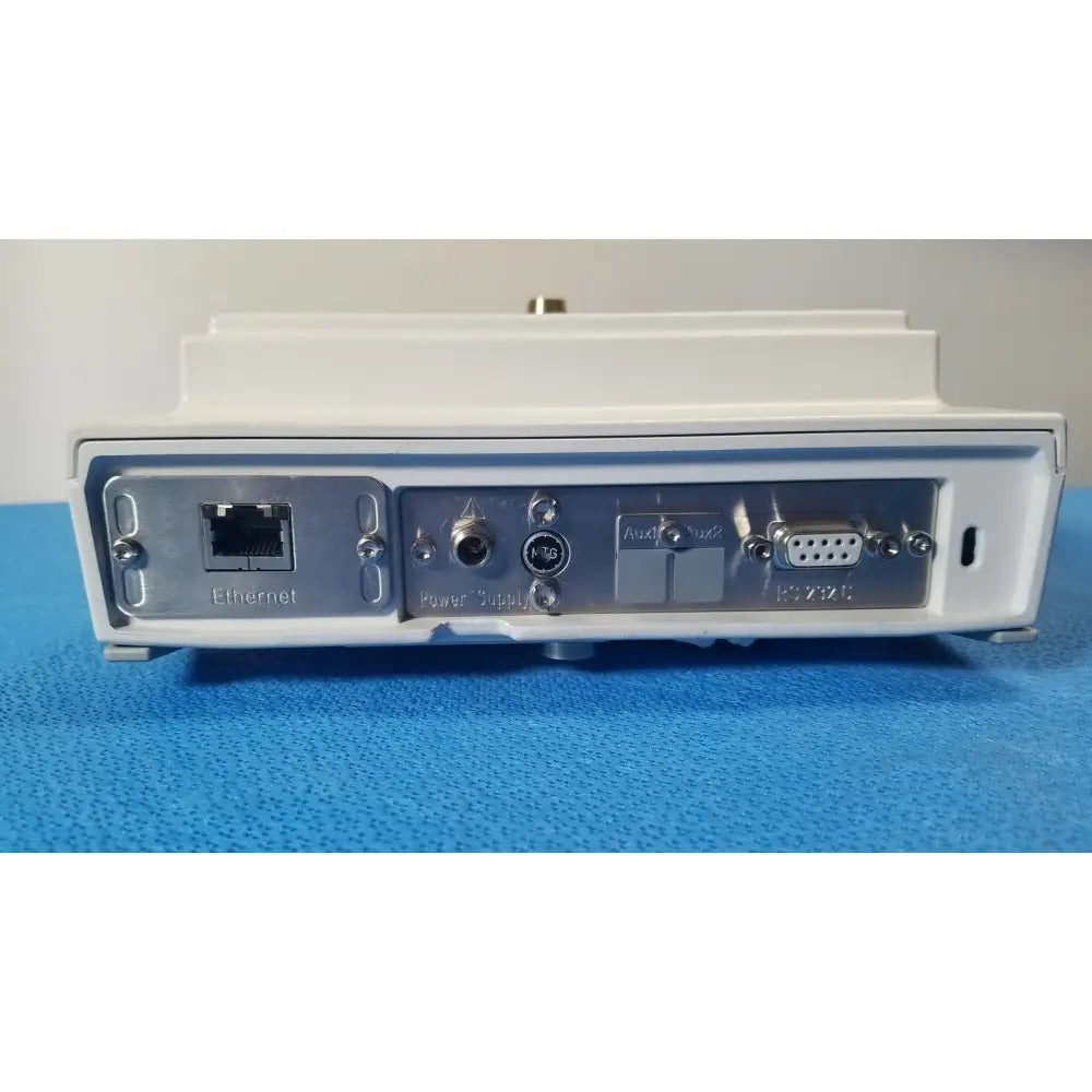 Back side of white rectangular mettler toledo xp5003sdr communications module with silver metal panel and ethernet port
