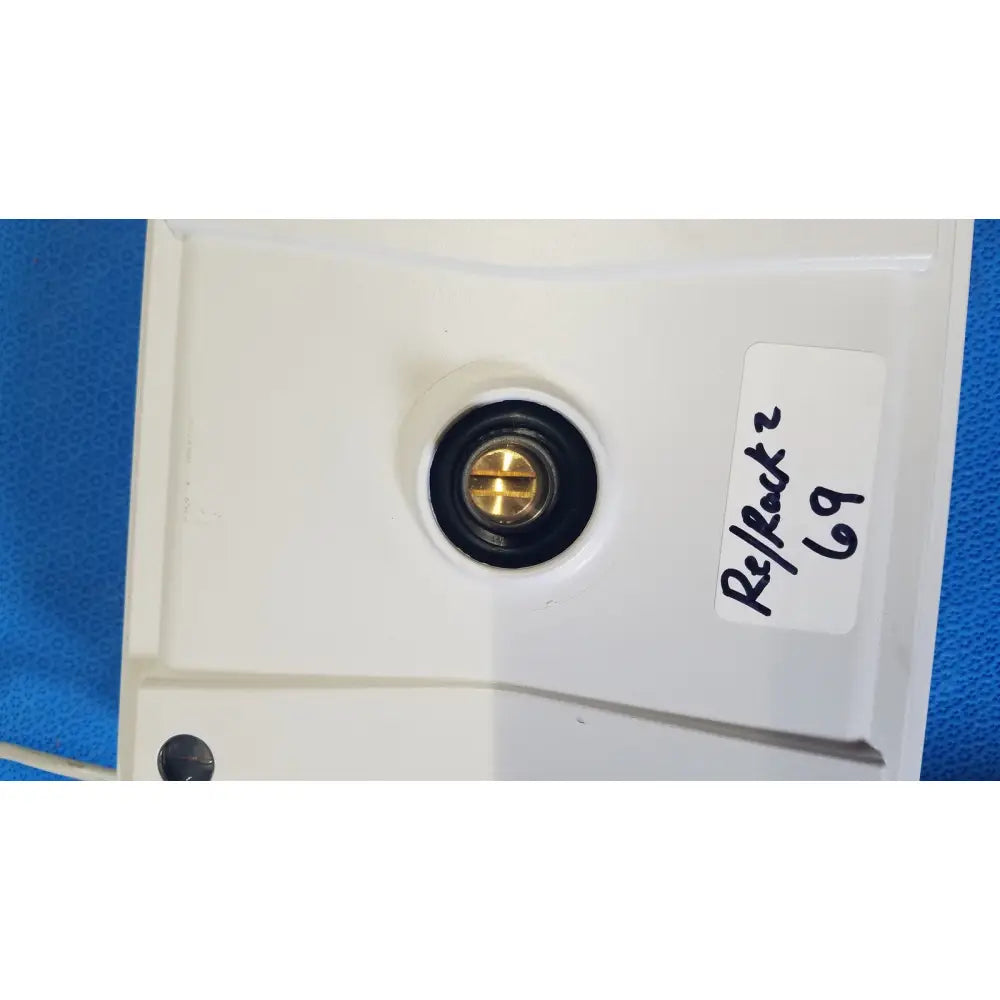 White plastic wall-mounted electrical outlet with brass screw and black rubber grommet for mettler toledo xp5003sdr communications module