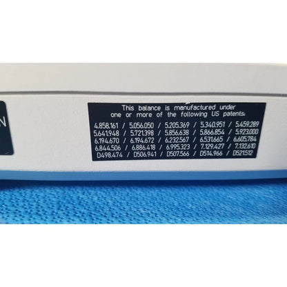 White balance with black patent label showing multiple US patents on the back of mettler toledo xp5003sdr communications module