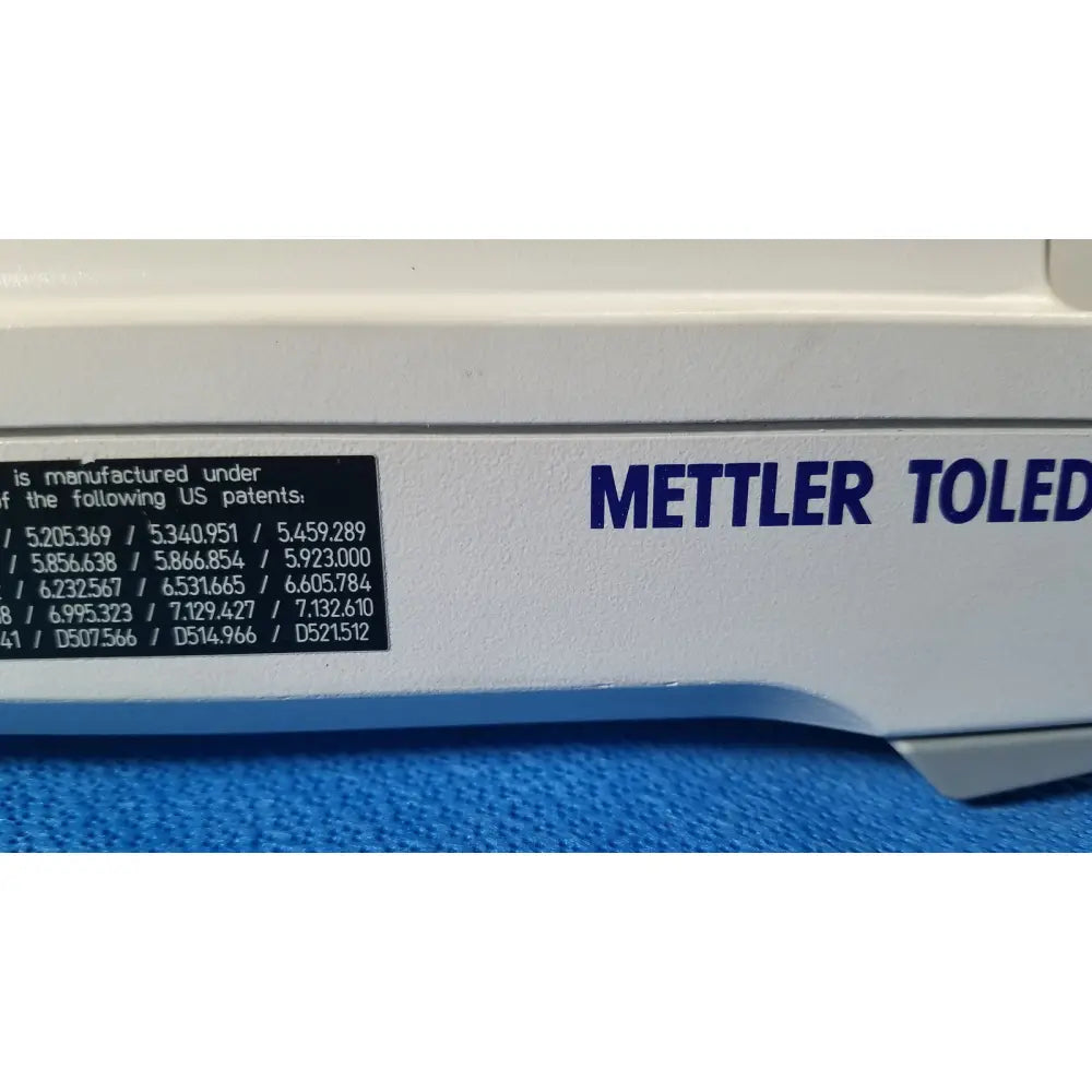 White mettler toledo analytical balance with blue lettering and black patent label for xp5003sdr communications module