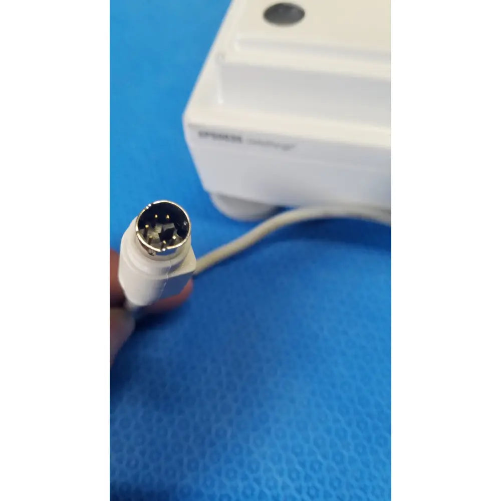 White plastic connector with metallic circular multi-pin plug on the back of mettler toledo xp5003sdr communications module