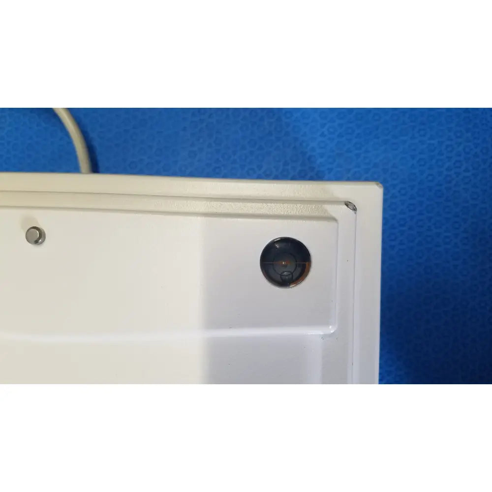 White plastic camera housing with circular recessed lens on mettler toledo xp5003sdr communications module
