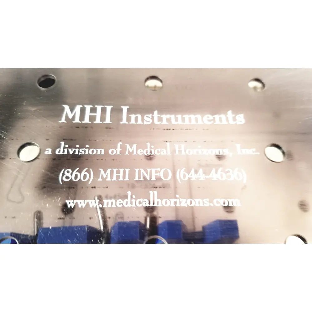 Metal plate on the back of the mhi instruments minilap uterine manipulator with engraved text and contact information