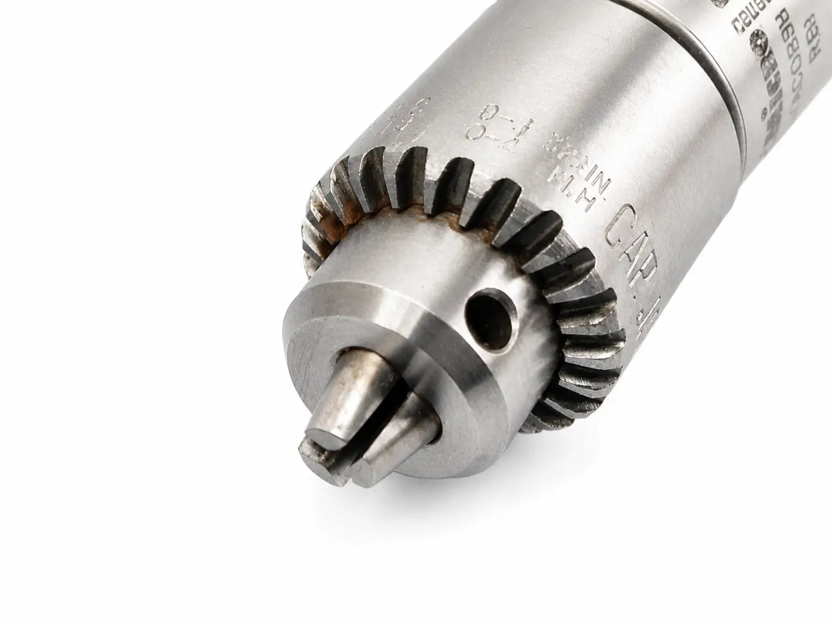 Silver metallic jacobs driver chuck with gear-like collar and engraved specifications in microaire 6680 driver chuck module