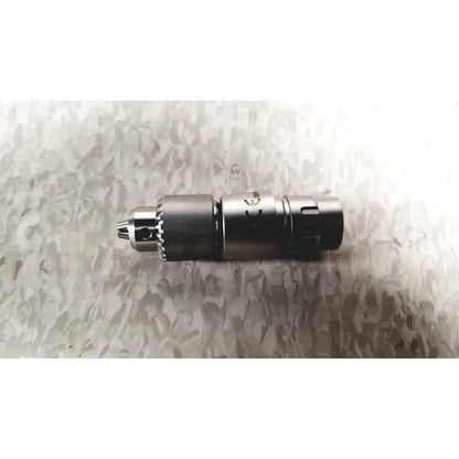 Silver metallic drill chuck with textured grip and engraved markings for microaire surgical instruments case