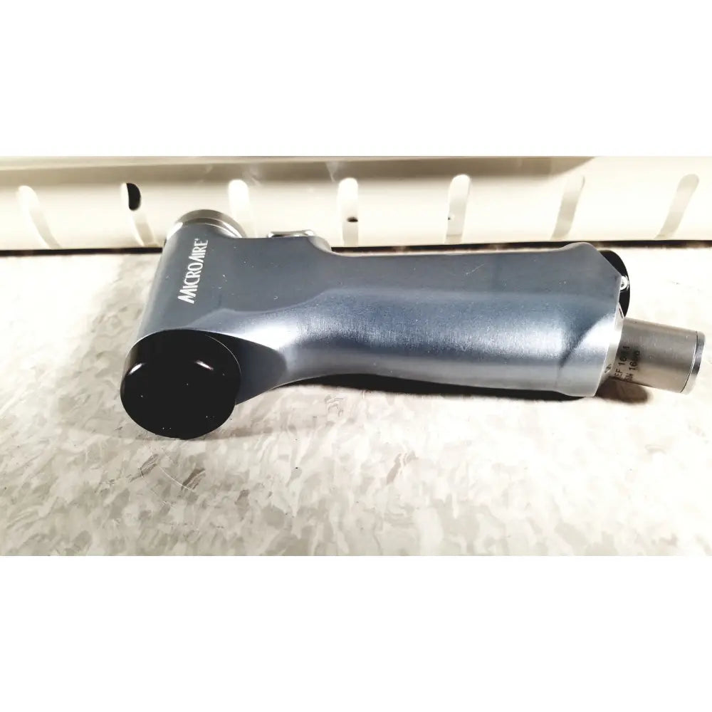 Gray and black microaire surgical instruments handheld air hammer with matte finish grip in a protective case