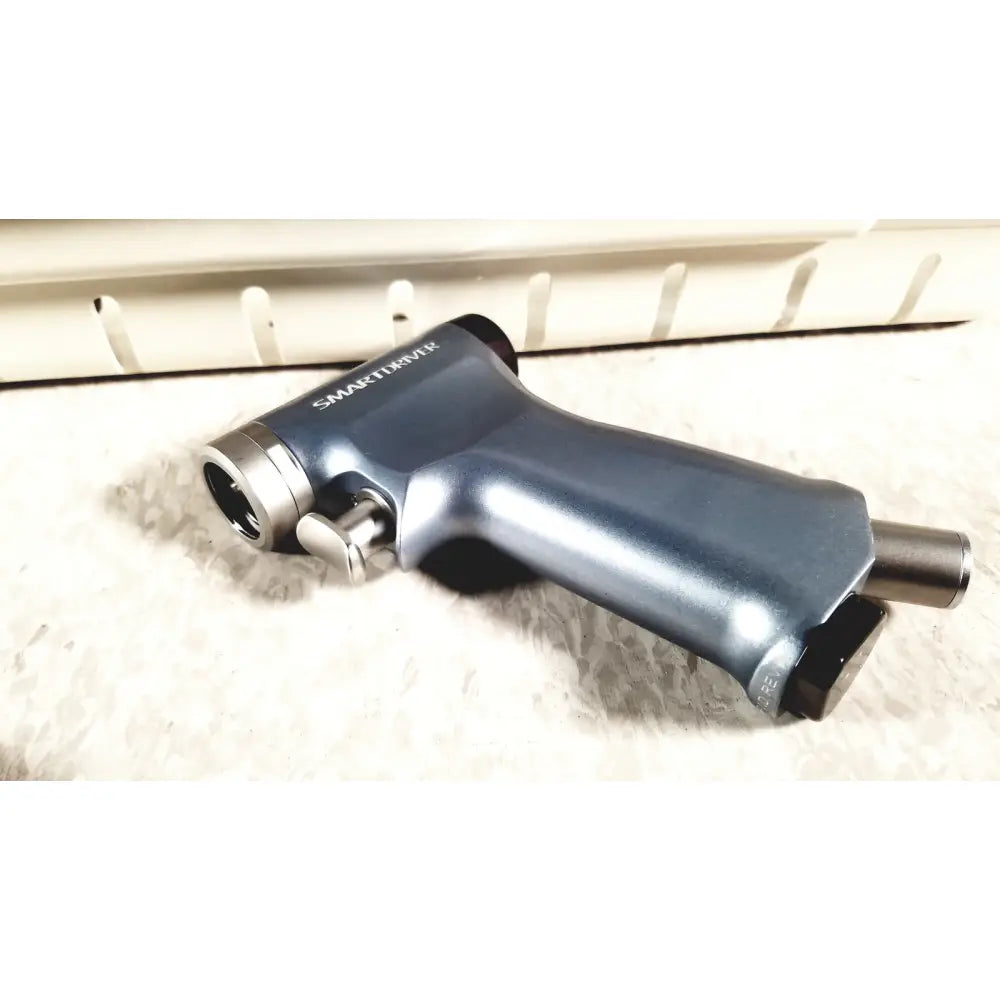 Dark blue metallic microaire surgical impact wrench with silver accents and textured grip for surgical instruments use