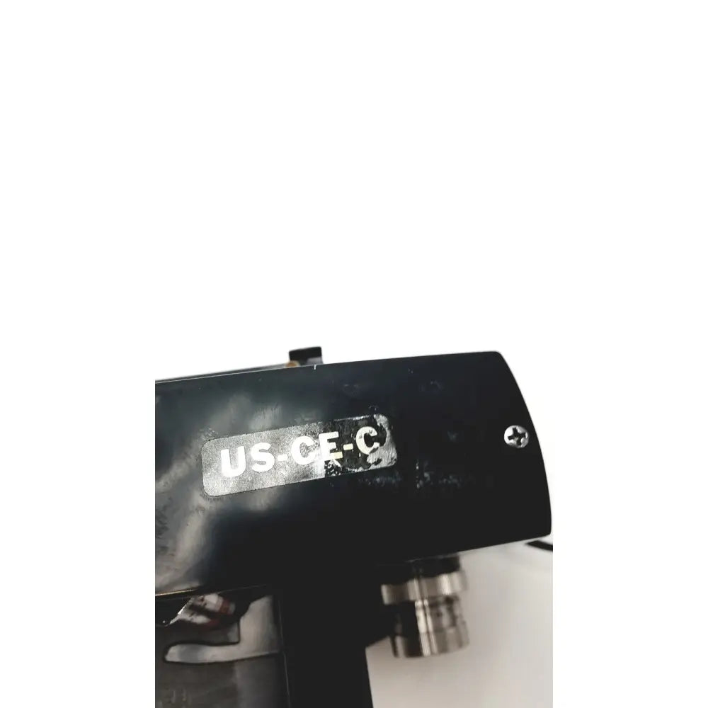 Microscope American Optical Spencer US-CE-C black with metallic objective lens and label on its body