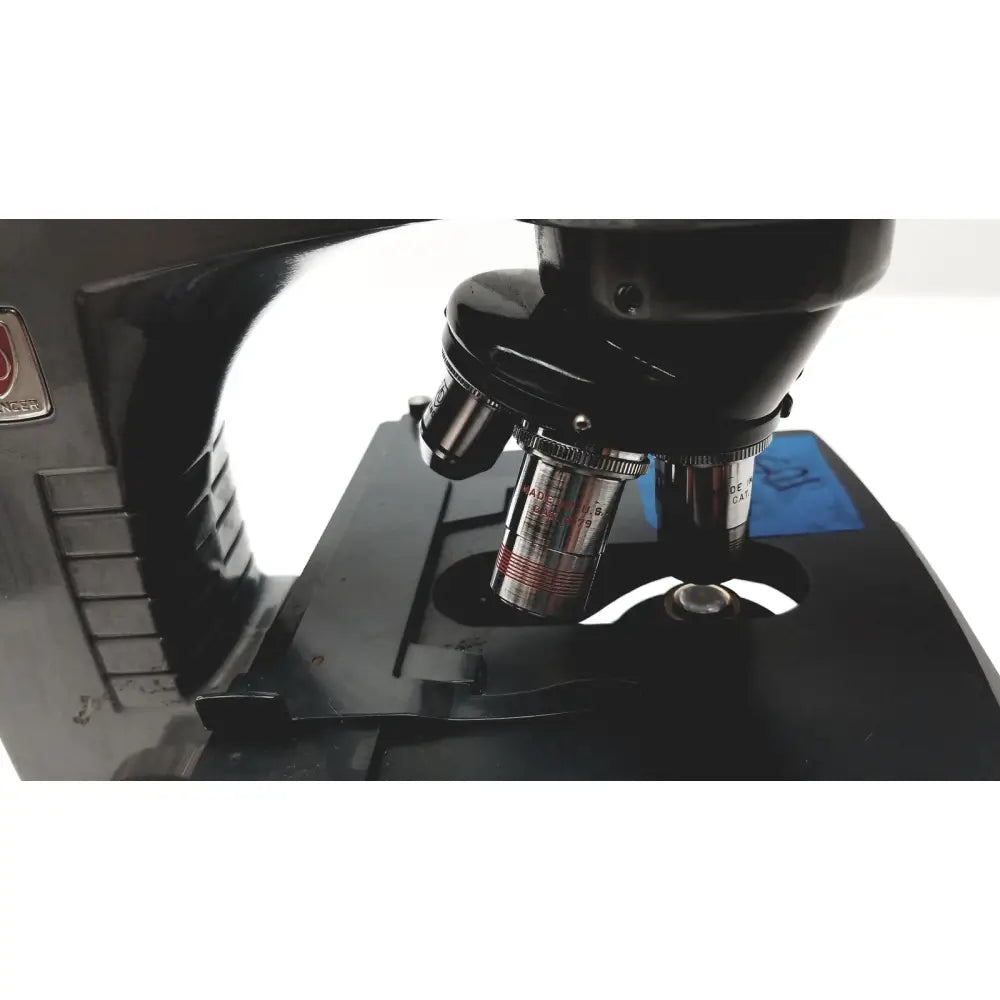 Black microscope american optical spencer with metallic objective lenses and silver stage for precise lab use