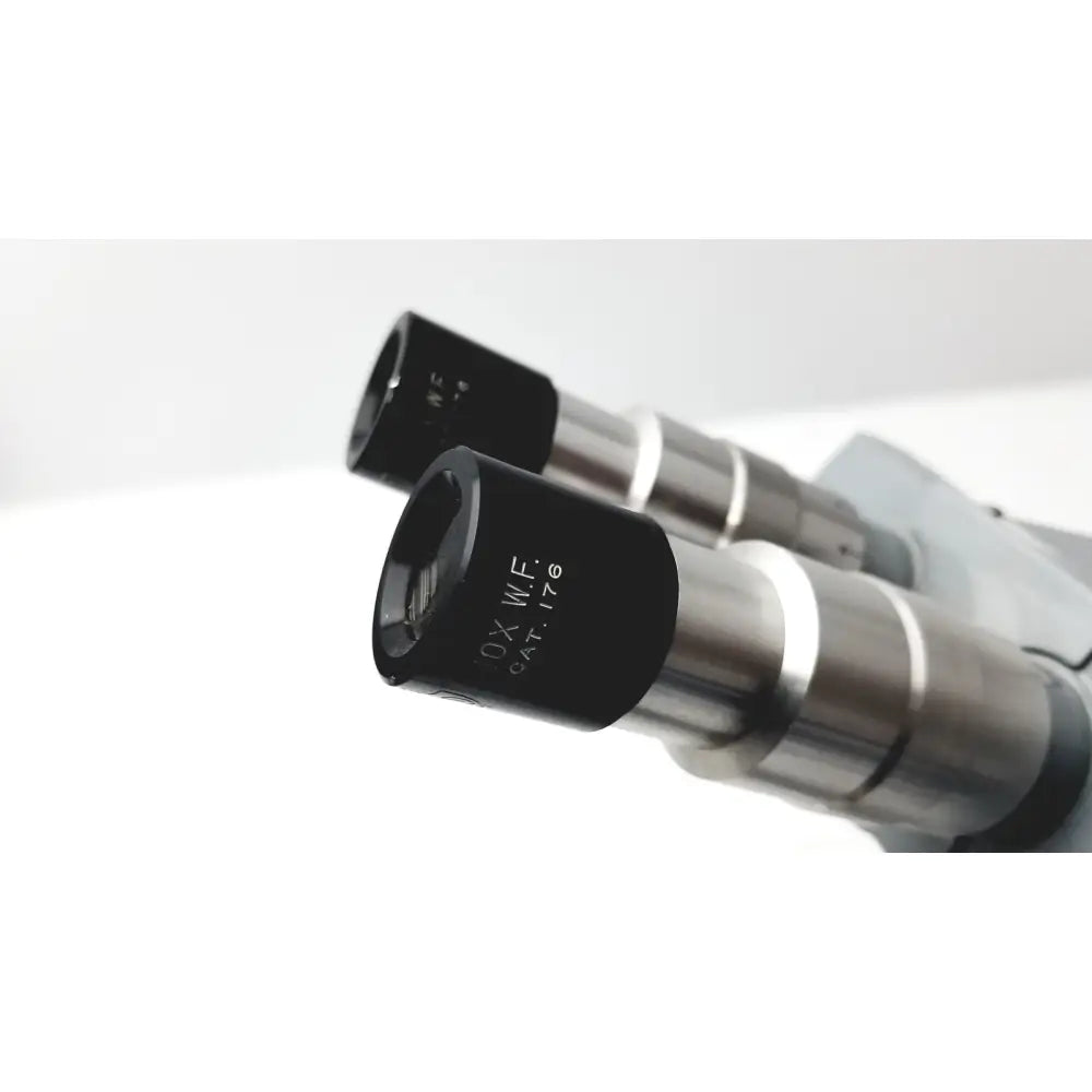 Black and silver microscope american optical spencer eyepieces with engraved markings for precision use