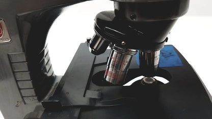 Black microscope american optical spencer with metallic objective lenses and silver stage for precise lab use