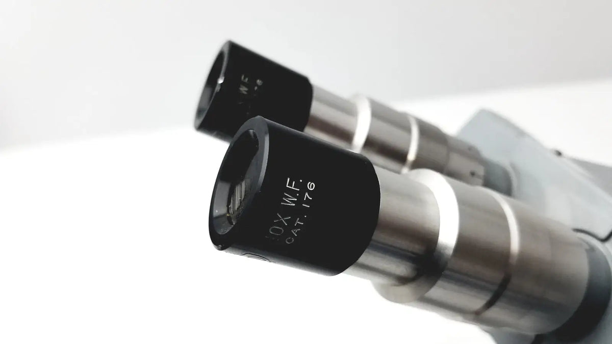 Black and silver microscope american optical spencer eyepieces with engraved markings for precision use