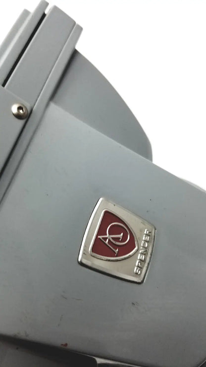 Gray metal american optical spencer microscope with red and silver emblem for precise scientific use