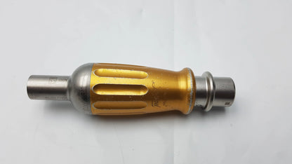 Gold and silver metallic Midas rex legend 1000 RPM ad03 perforator driver handle with textured grip and engraved branding