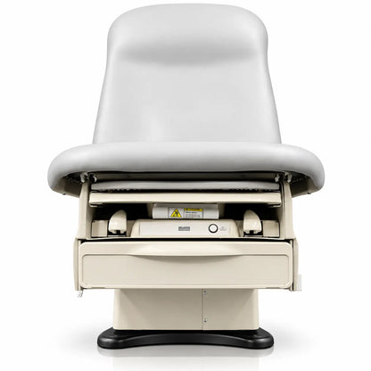Beige Midmark 625 barrier-free power exam table with padded curved backrest and wired control examination table platform