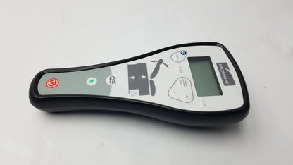 Midmark Qe wireless hand remote control with black and gray casing, small screen, and colored buttons for remote control use
