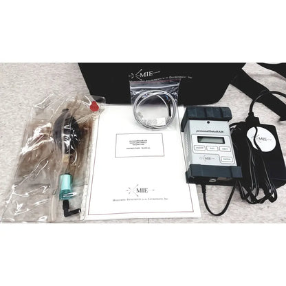 Black and gray mie personal dataram environmental monitor with digital display and labeled buttons for real-time aerosol tracking