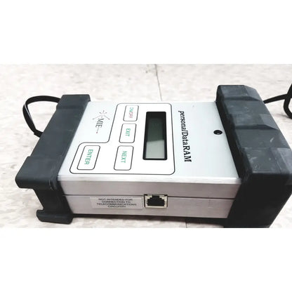 Silver and black mie personal dataram real-time aerosol monitor with small screen green-labeled buttons and ethernet port