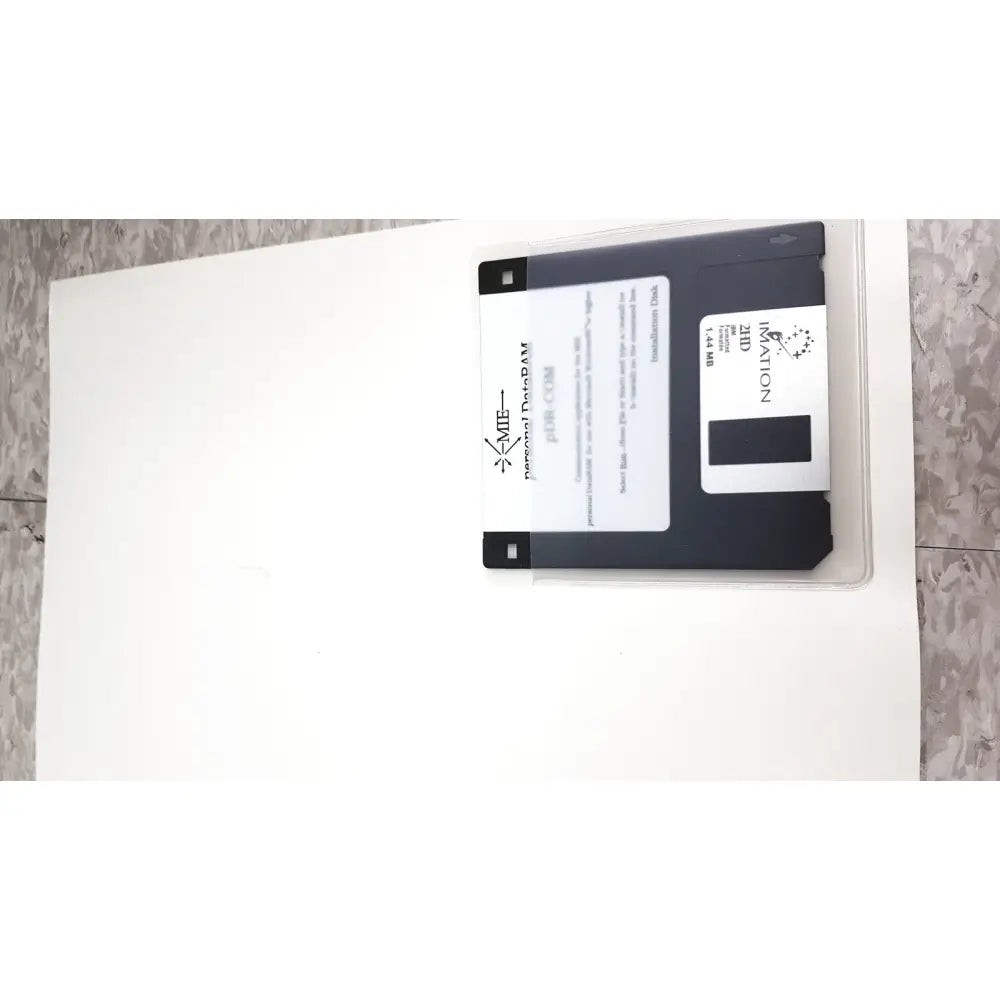 Black 3.5-inch floppy disk with white label and clear case branded personal dataram for mie personal dataram monitor