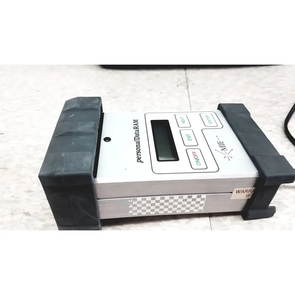 White and silver mie personal dataram real-time aerosol monitor with black rubberized grips and digital screen buttons