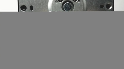 Metallic circular component with multiple holes and central darkened area on the back side of p24h g4 monitor stand