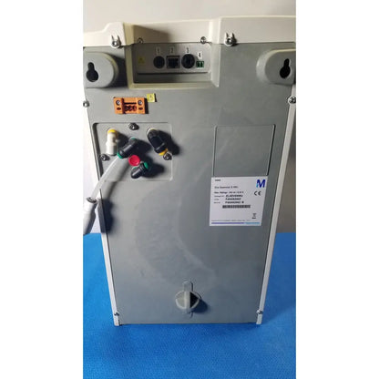 Gray metallic industrial control panel with labeled ports and warning symbols on the back of millipore elix essential system