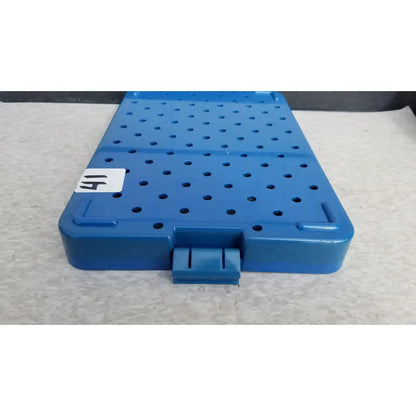 Blue plastic sterilization instrument tray with perforated surface and molded handle by Mitek Products model 215000