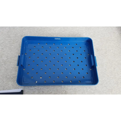 Blue plastic sterilization instrument tray with grid holes and side handles by Mitek Products for instrument sterilization