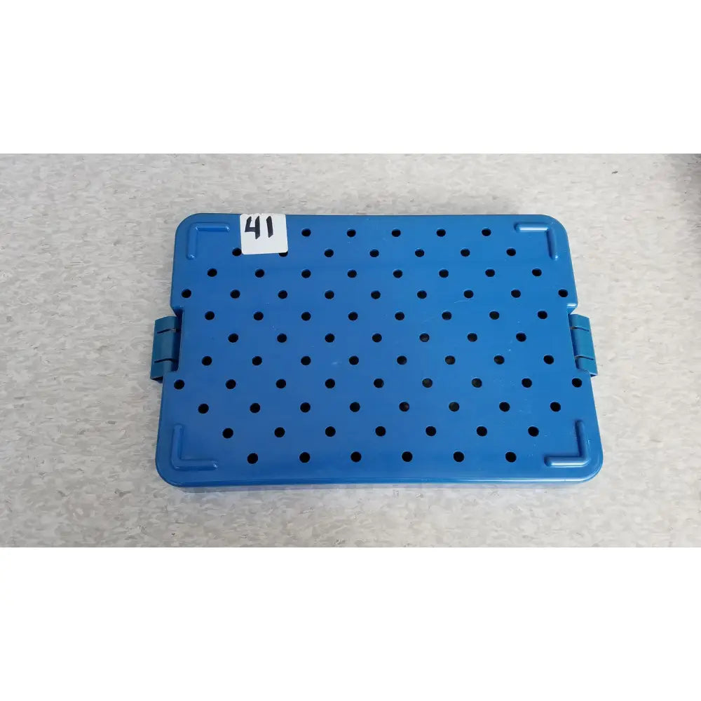 Blue plastic sterilization instrument tray by mitek products with grid holes and reinforced corners for sterilization use