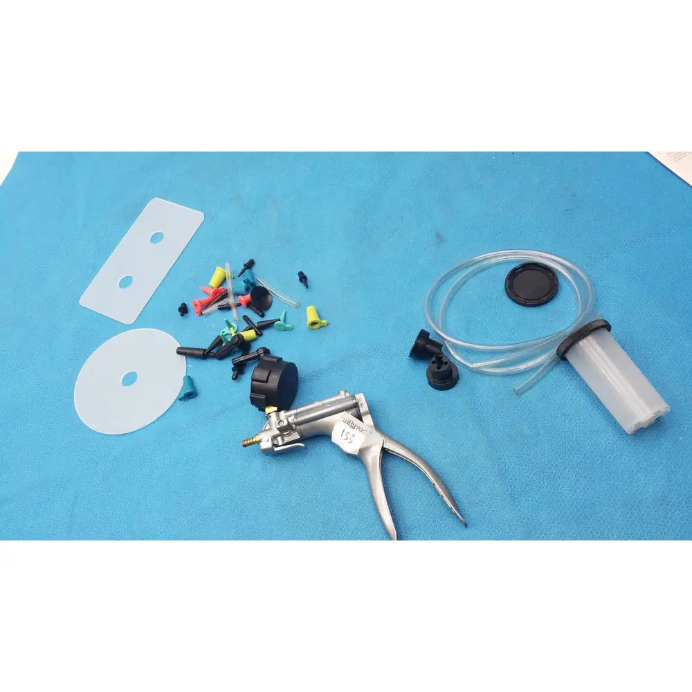 Silver-handled hydraulic pump with black knobs and transparent fluid reservoir from mityvac mv8500 elite automotive kit