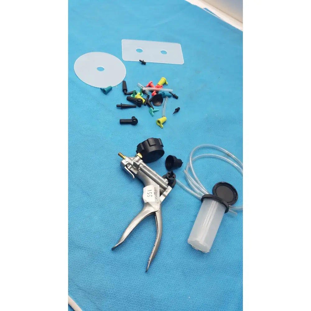Silver-handled medical syringe pump with black caps clear tubing and colored connectors in mityvac mv8500 elite automotive kit