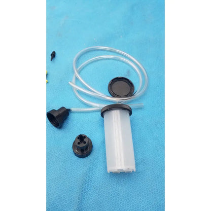 Clear plastic syringe-style fluid reservoir with black threaded cap and tube in mityvac mv8500 elite automotive kit