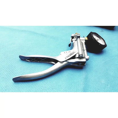 Silver metal punch tool with black rubberized grips and pressure gauge in mityvac mv8500 elite automotive kit