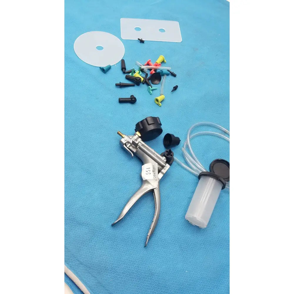 Silver surgical syringe pump with black knobs and clear fluid reservoir in the mityvac mv8500 elite automotive kit