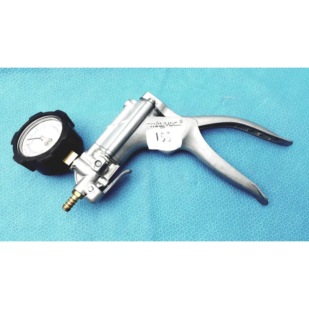Silver metallic surgical vacuum pump with black pressure gauge and brass fittings in mityvac mv8500 elite automotive kit
