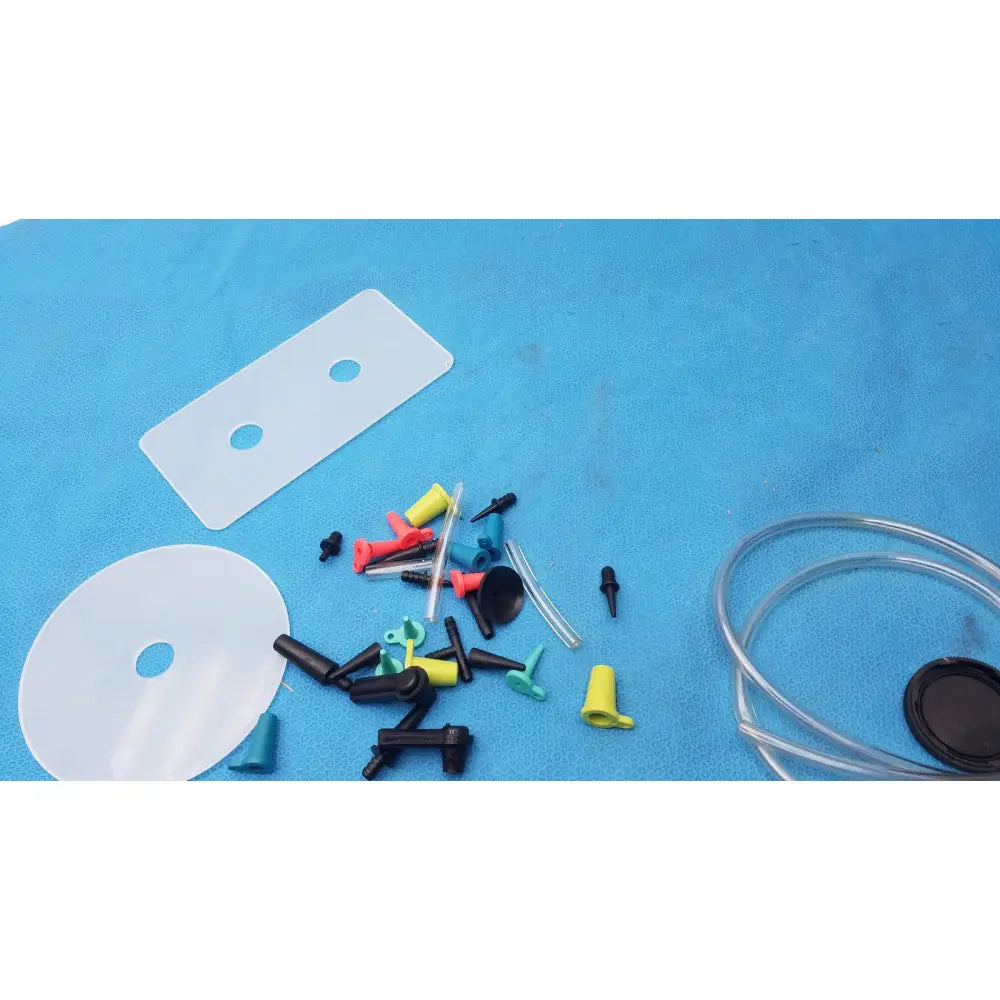 A collection of colorful plastic and silicone tubing connectors caps and adapters for mityvac mv8500 elite automotive kit