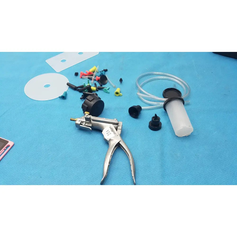 Silver-handled hydraulic pump with black accents and transparent fluid reservoir in mityvac mv8500 elite automotive kit