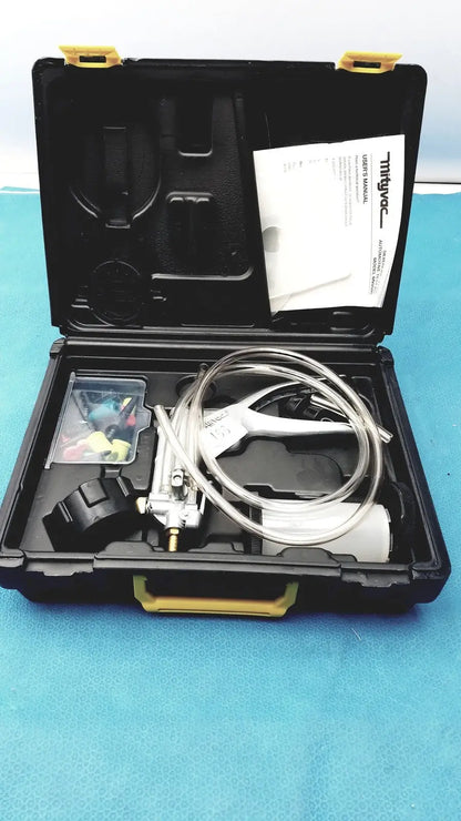 Black and yellow mityvac mv8500 elite automotive kit with clear tubing metal components and plastic accessory container