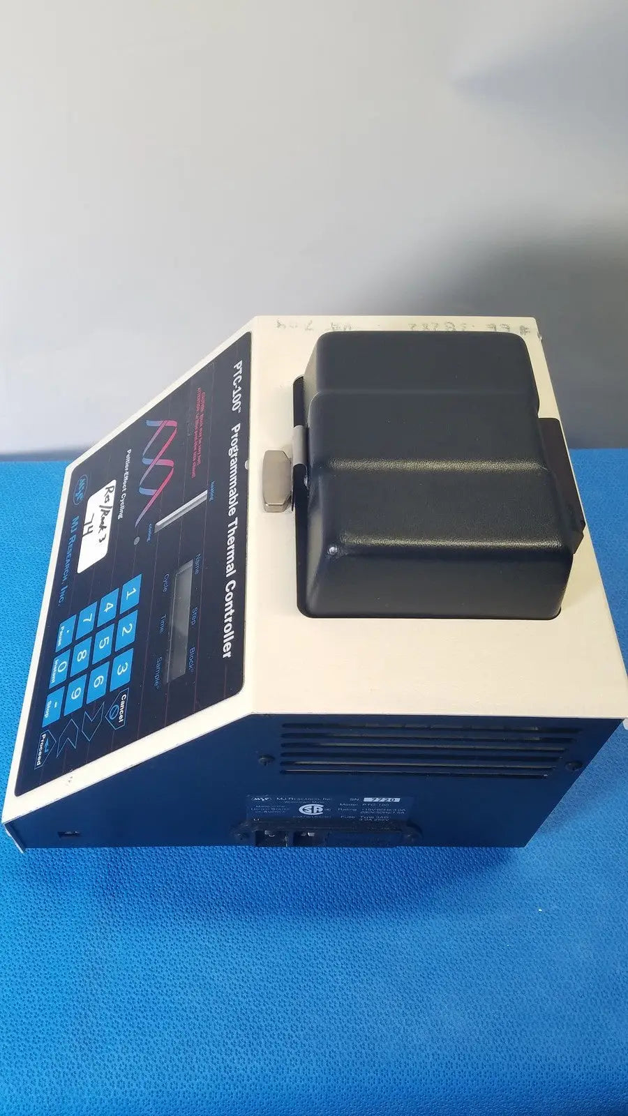 Beige and blue mj research ptc-100 programmable thermal controller with black lid labeled pcr-450 thermal cycler