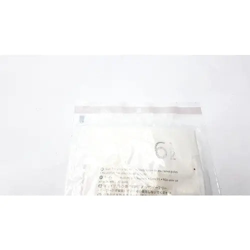 A white plastic bag with a clear seal containing molnlycke biogel pl surgical gloves size 6 1/2 with multilingual text