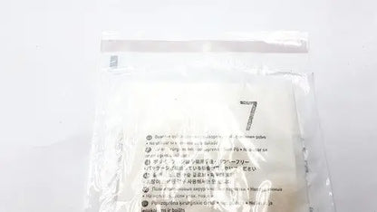 A clear plastic bag with white soft filter papers and multilingual instructions for molnlycke biogel pl surgical gloves size 7