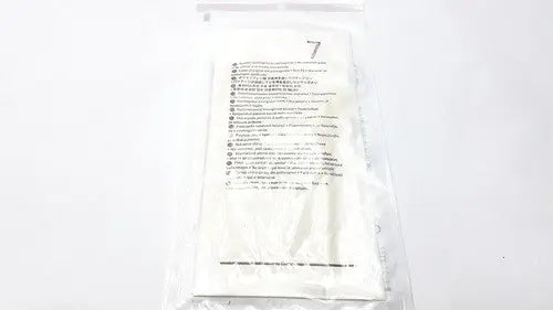 A white sterile gauze pad sealed in clear packaging with instructions and size 7 for molnlycke biogel pl surgical gloves size 7