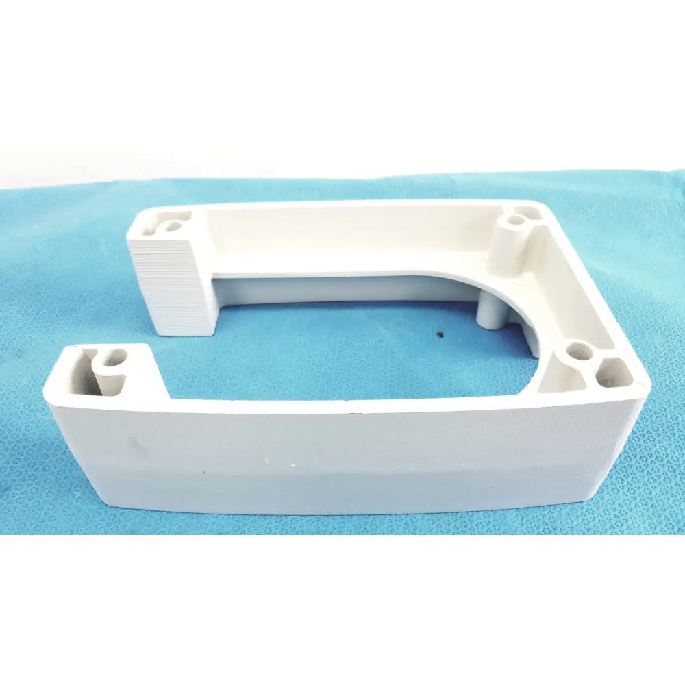 White plastic u-shaped monitor mounting arm bracket with integrated mounting holes and textured edges