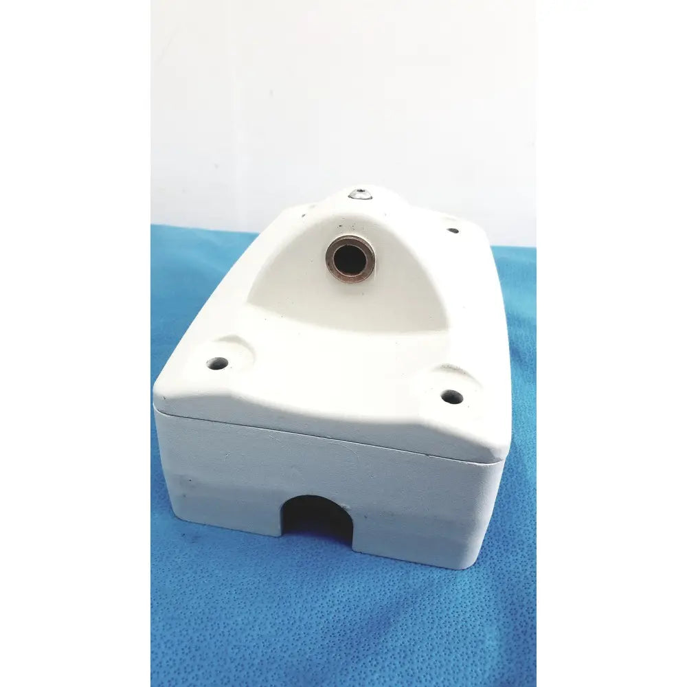 White mounting arm plastic housing with circular top opening and rectangular bottom cutout for monitor mounting arm brackets