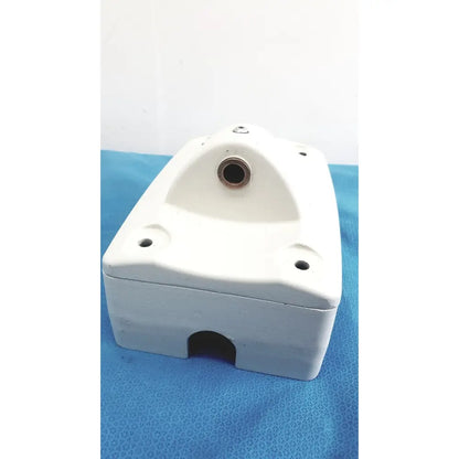 White mounting arm plastic housing with circular top opening and rectangular bottom cutout for monitor mounting arm brackets